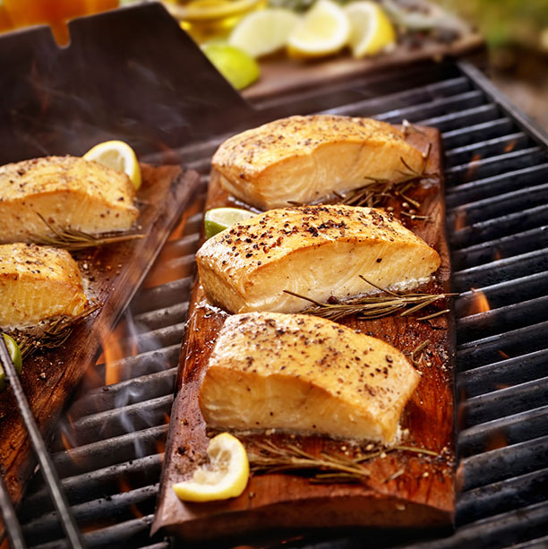 Cedar Plank Salmon Fillets on an outdoor BBQ