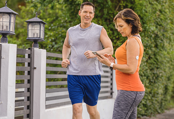 woman-checking-her-cgm-device